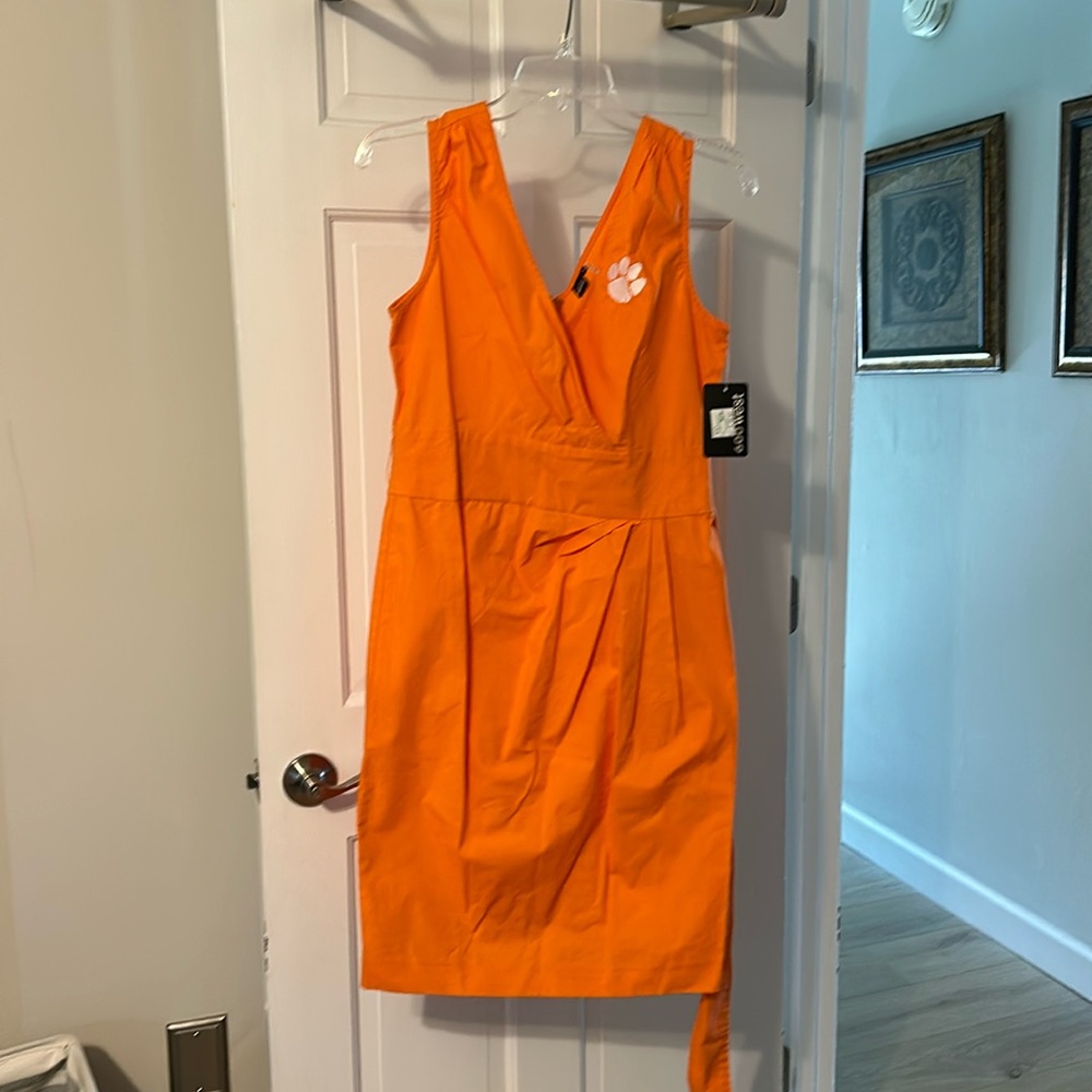 Orange sleeveless dress with added embroidered Clemson paw.